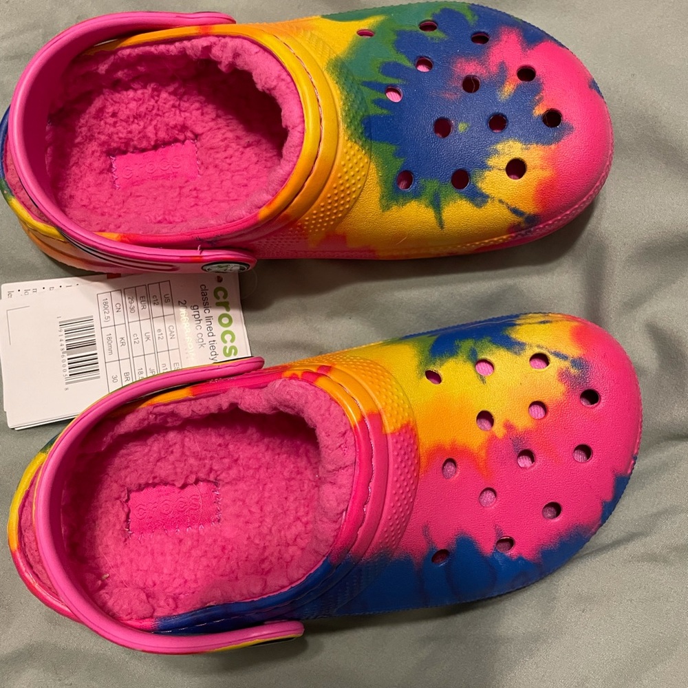 Girls lined crocs.